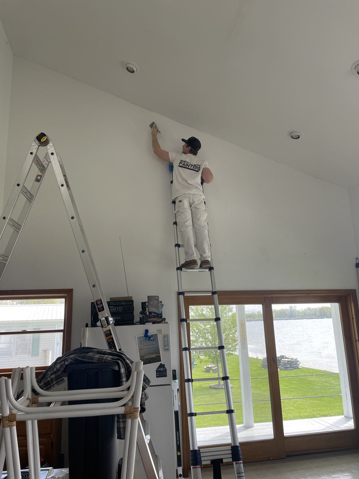 Jacob McConahay working on a lakefront home — North Country Painters